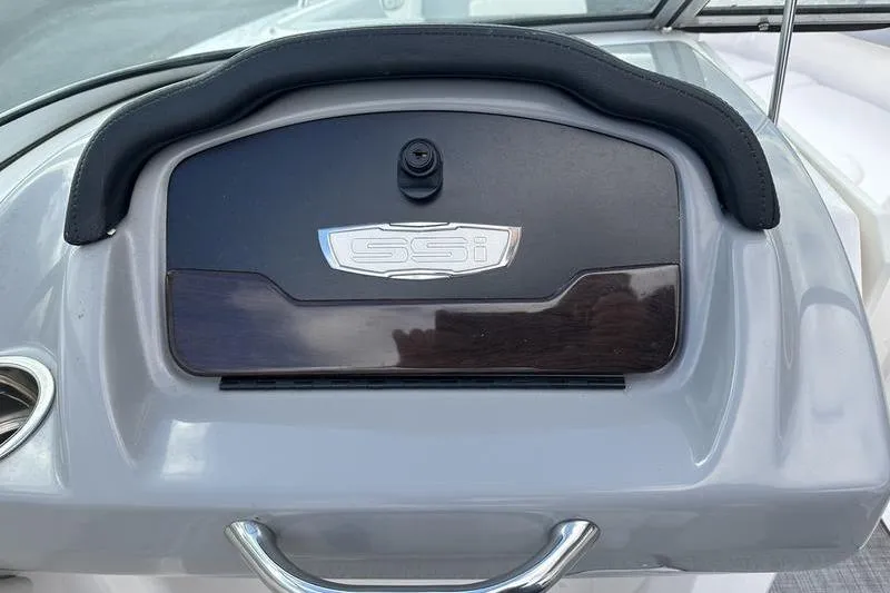 Slide: The Image of Dashboard of 2022 Chaparral 23 SSi boat with SSI emblem and sleek design. - 23