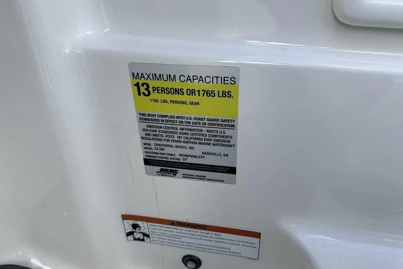 Slide: The Image of 2022 Chaparral 23 SSi capacity label: 13 persons or 1765 lbs maximum load. - 24