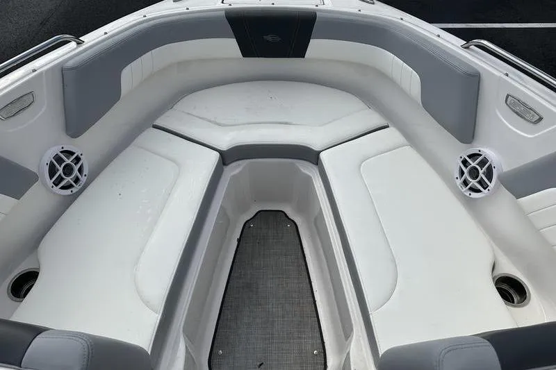 Slide: The Image of 2022 Chaparral 23 SSi boat interior with gray and white seating. - 26