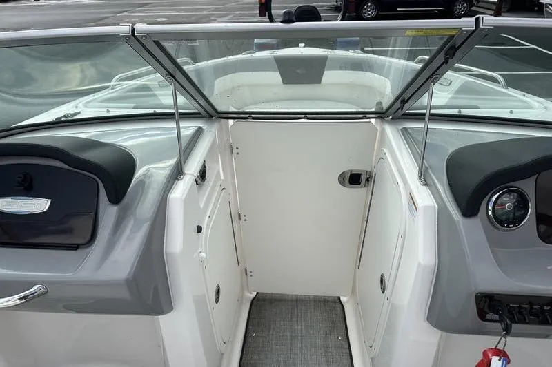 Slide: The Image of 2022 Chaparral 23 SSi boat interior with windshield and dashboard view. - 31