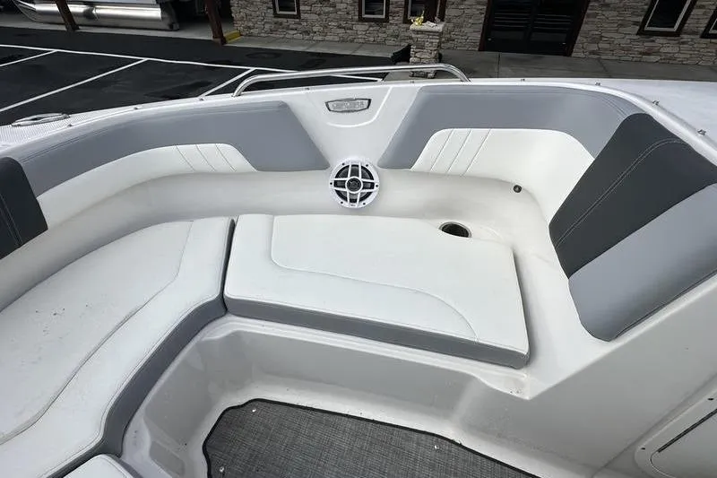 Slide: The Image of Interior seating of 2022 Chaparral 23 SSi boat with gray and white upholstery. - 4