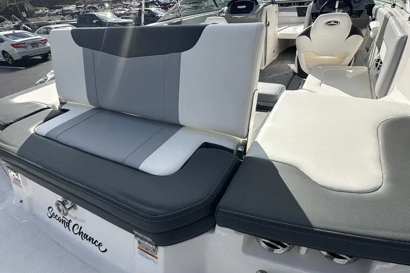 Slide: The Image of 2022 Chaparral 23 SSi boat interior with gray and white seating, labeled "Second Chance." - 6