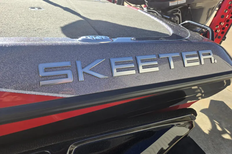 Slide: The Image of 2022 Skeeter FXR20 Apex boat with metallic finish and logo detail. - 10