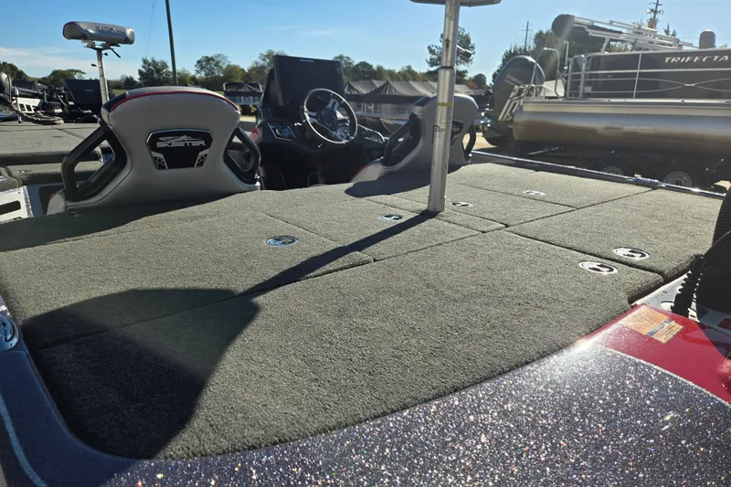 Slide: The Image of 2022 Skeeter FXR20 Apex boat with spacious deck and sleek design. - 12