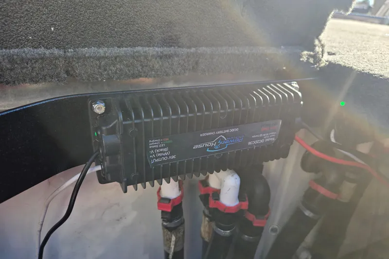 Slide: The Image of Battery charger in 2022 Skeeter FXR20 Apex boat, mounted with wiring and connectors. - 14