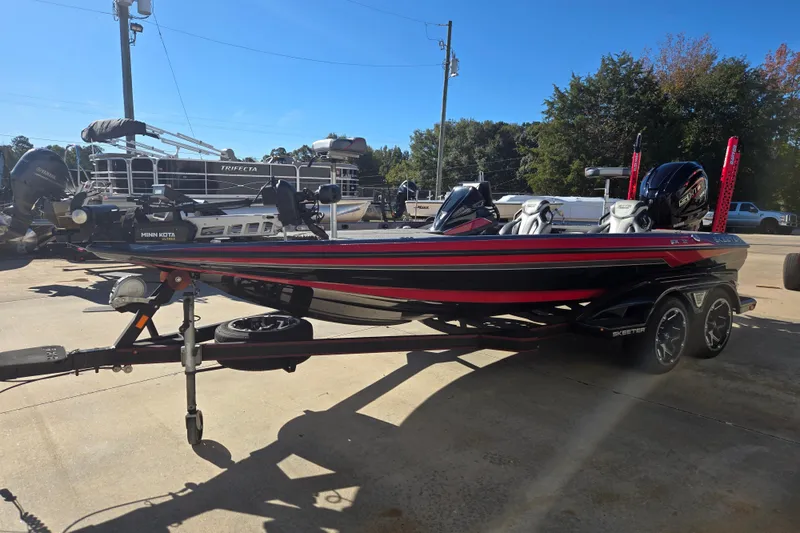 Slide: The Image of 2022 Skeeter FXR20 Apex boat on trailer, featuring sleek design and vibrant colors. - 2