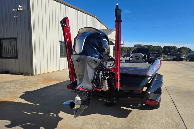 Slide: The Image of 2022 Skeeter FXR20 Apex boat with powerful outboard motor, parked outdoors. - 3