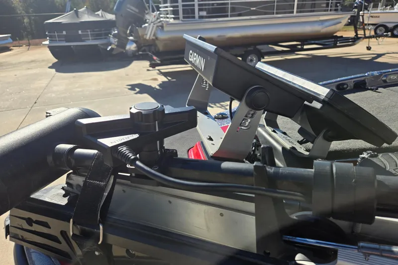 Slide: The Image of 2022 Skeeter FXR20 Apex boat with Garmin electronics and motor mount, docked outdoors. - 8