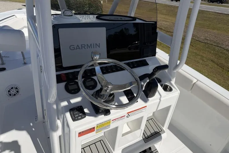 Slide: The Image of 2026 Sea Hunt Ultra 219 boat console with Garmin navigation system and steering wheel. - 10