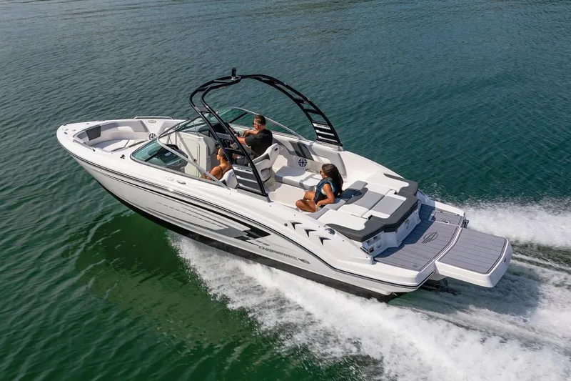 Slide: The Image of Manufacturer Provided Image: 2025 Chaparral 23 SSi boat cruising on open water with passengers onboard. - 1