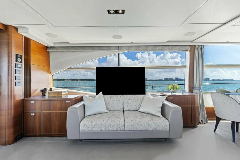 Slide: The Image of Luxurious 2018 Princess Y75 yacht interior with elegant sofa and ocean view. - 12