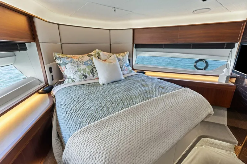 Slide: The Image of Luxurious bedroom interior of 2018 Princess Y75 yacht with elegant bedding and ocean view. - 33