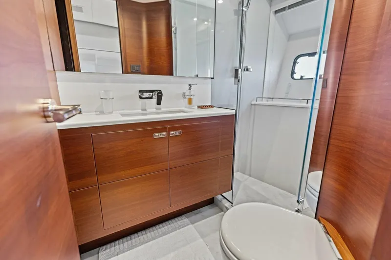 Slide: The Image of Luxurious bathroom in 2018 Princess Y75 yacht with wooden cabinetry and modern fixtures. - 44