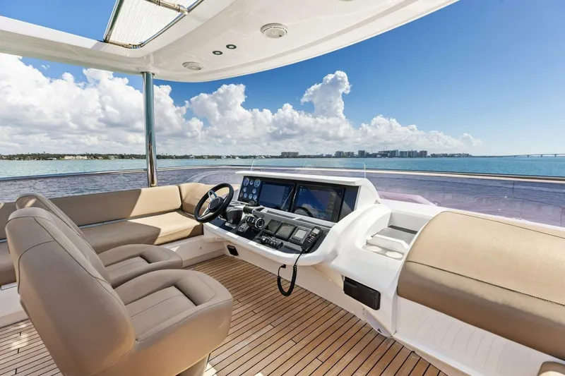 Slide: The Image of Luxurious 2018 Princess Y75 yacht helm with panoramic ocean view and modern controls. - 49