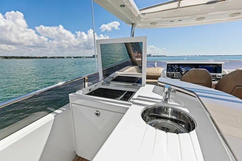 Slide: The Image of Luxury yacht Princess Y75, 2018 model, featuring outdoor kitchen and stunning ocean view. - 51