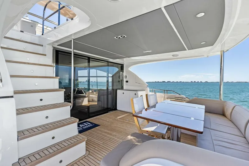 Slide: The Image of Luxurious 2018 Princess Y75 yacht deck with seating, table, and ocean view. - 53