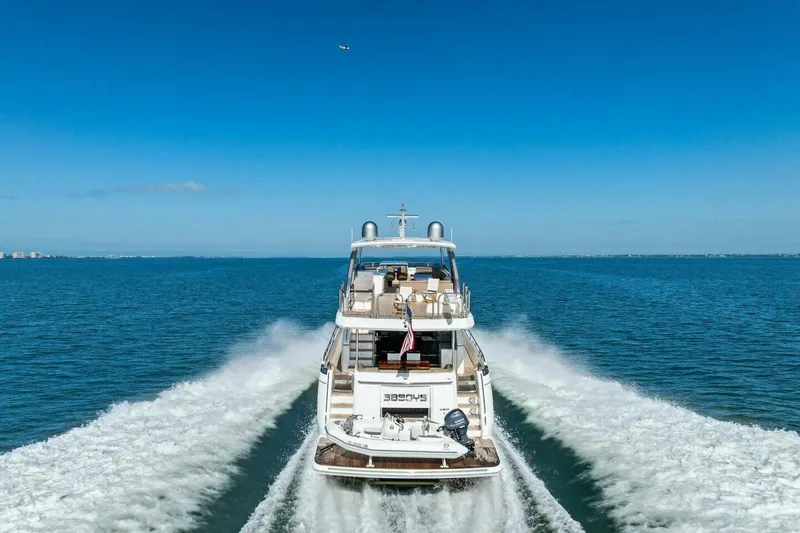 Slide: The Image of Luxurious 2018 Princess Y75 yacht cruising on open blue sea under clear sky. - 78