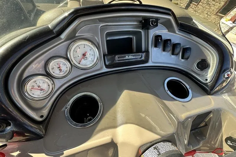 Slide: The Image of Dashboard of 2023 Sun Tracker Party Barge 20 DLX with gauges and controls. - 17