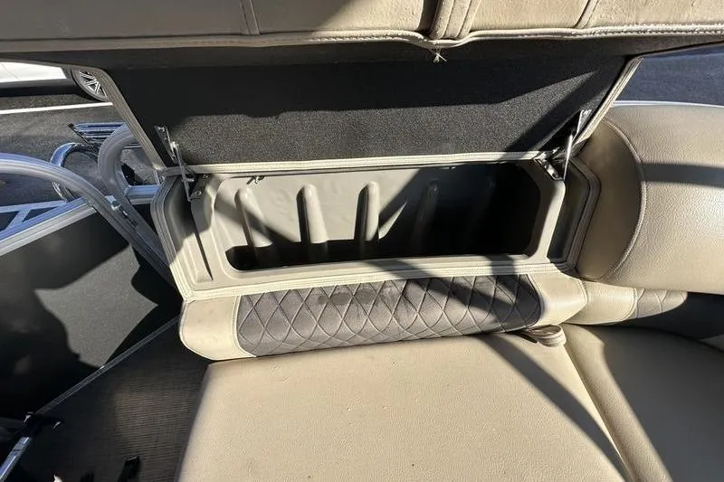 Slide: The Image of Open storage compartment in 2023 Sun Tracker Party Barge 20 DLX boat seat. - 20