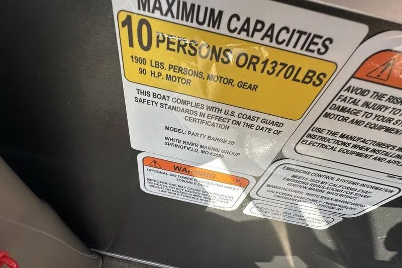 Slide: The Image of Capacity label on 2023 Sun Tracker Party Barge 20 DLX, max 10 persons or 1370 lbs. - 23