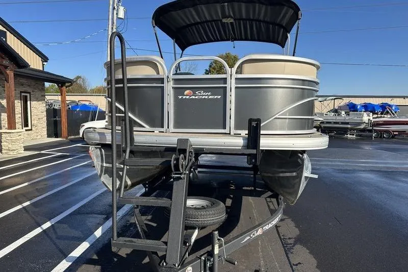 Slide: The Image of 2023 Sun Tracker Party Barge 20 DLX pontoon boat on trailer, outdoor display. - 3