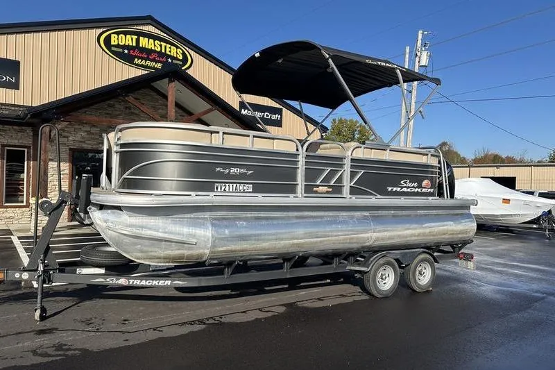 Slide: The Image of 2023 Sun Tracker Party Barge 20 DLX pontoon boat on trailer at Boat Masters. - 4