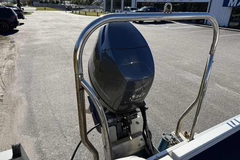 Slide: The Image of 2018 Godfrey SWEETWATER 2286 SB boat with Yamaha 90 outboard motor in parking lot. - 16