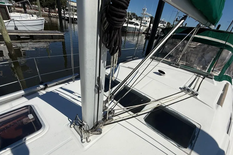 Slide: The Image of 2005 Beneteau Oceanis 373 sailboat deck with rigging and marina view. - 15