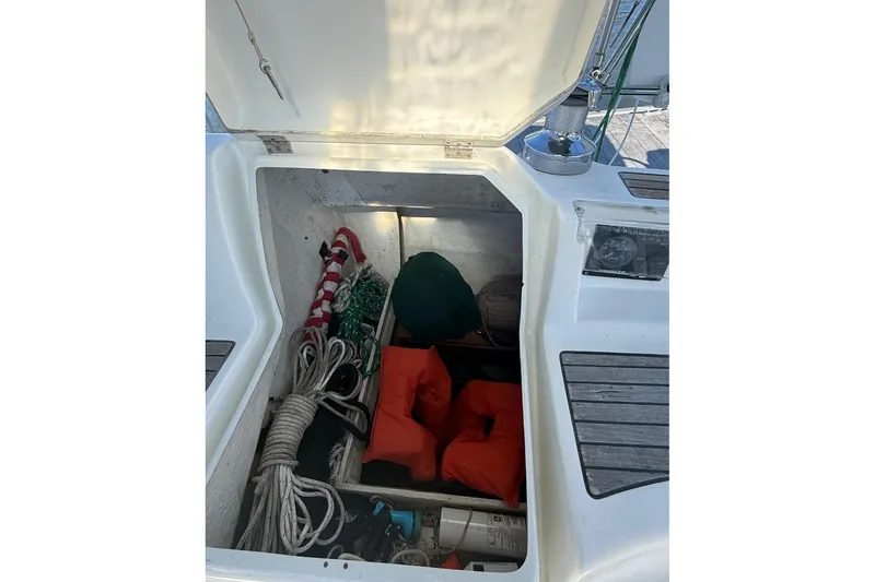 Slide: The Image of Storage compartment of a 2005 Beneteau Oceanis 373 sailboat with ropes and life jackets. - 22