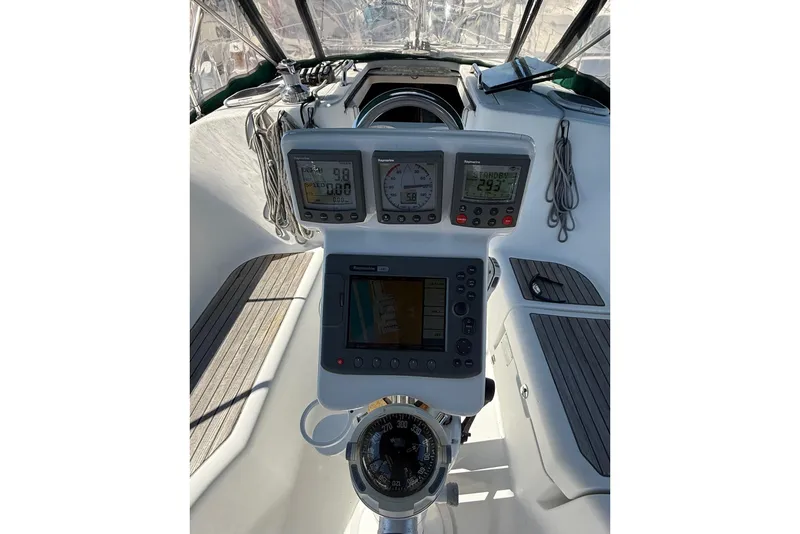 Slide: The Image of Cockpit of 2005 Beneteau Oceanis 373 sailboat with navigation instruments and steering wheel. - 27