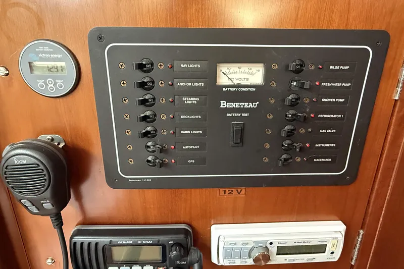 Slide: The Image of Control panel of a 2005 Beneteau Oceanis 373 sailboat with various switches and gauges. - 35