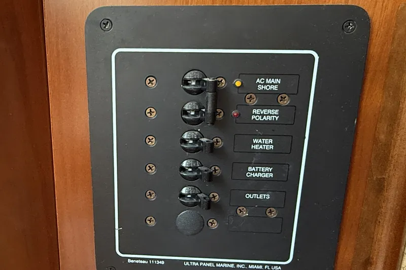 Slide: The Image of Electrical panel on a 2005 Beneteau Oceanis 373 sailboat, featuring various switches and indicators. - 36
