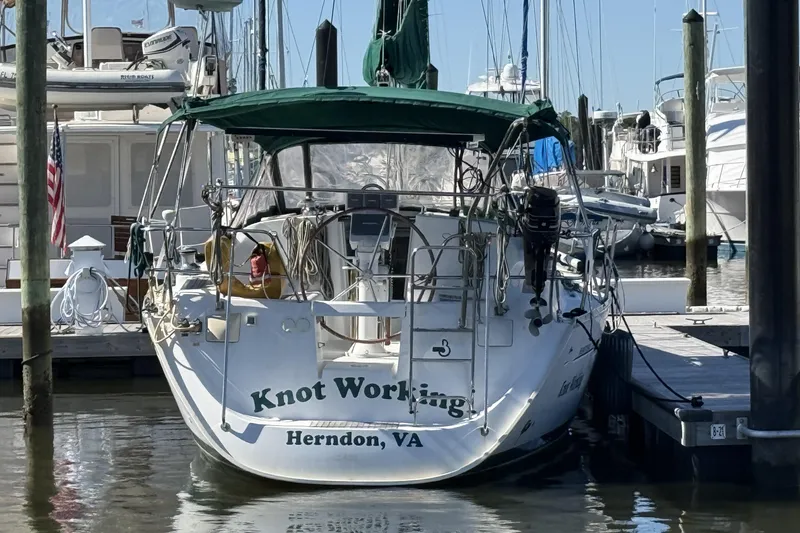 Slide: The Image of 2005 Beneteau Oceanis 373 sailboat docked, named "Knot Working," Herndon, VA. - 4