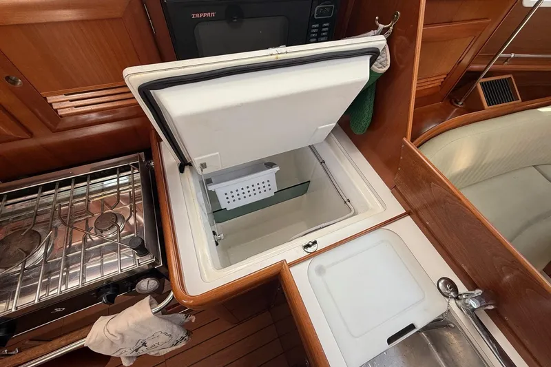 Slide: The Image of Interior of 2005 Beneteau Oceanis 373 yacht kitchen with stove, sink, and storage. - 45
