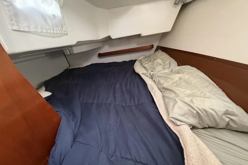 Slide: The Image of Cozy cabin interior of 2005 Beneteau Oceanis 373 sailboat with comfortable bedding. - 47