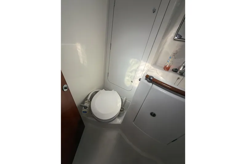 Slide: The Image of Bathroom interior of 2005 Beneteau Oceanis 373 sailboat, featuring toilet and sink. - 54