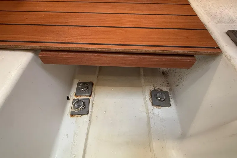 Slide: The Image of Interior view of 2005 Beneteau Oceanis 373 sailboat with wooden flooring and metal fixtures. - 57