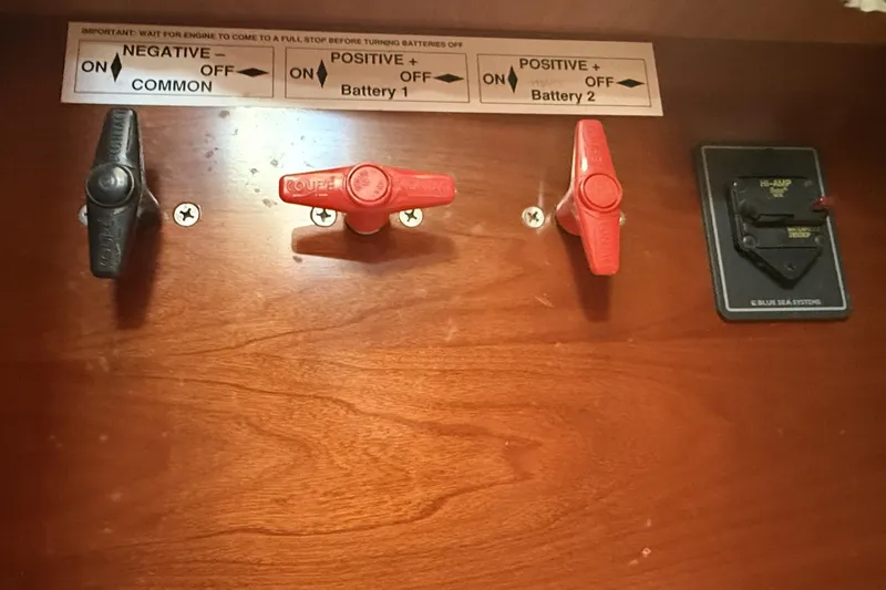 Slide: The Image of Control panel of a 2005 Beneteau Oceanis 373 sailboat with battery switches. - 59