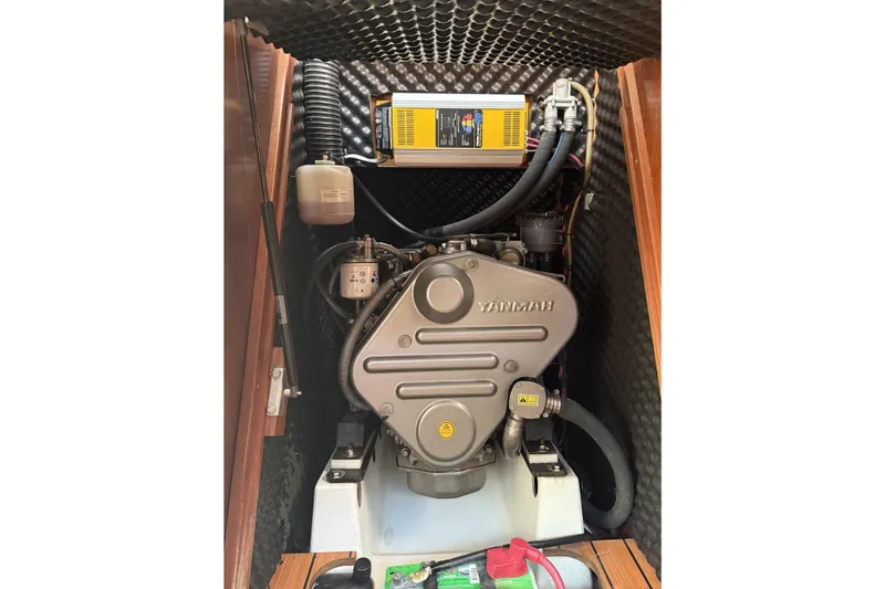 Slide: The Image of Engine compartment of a 2005 Beneteau Oceanis 373 sailboat, featuring a Yanmar engine. - 60