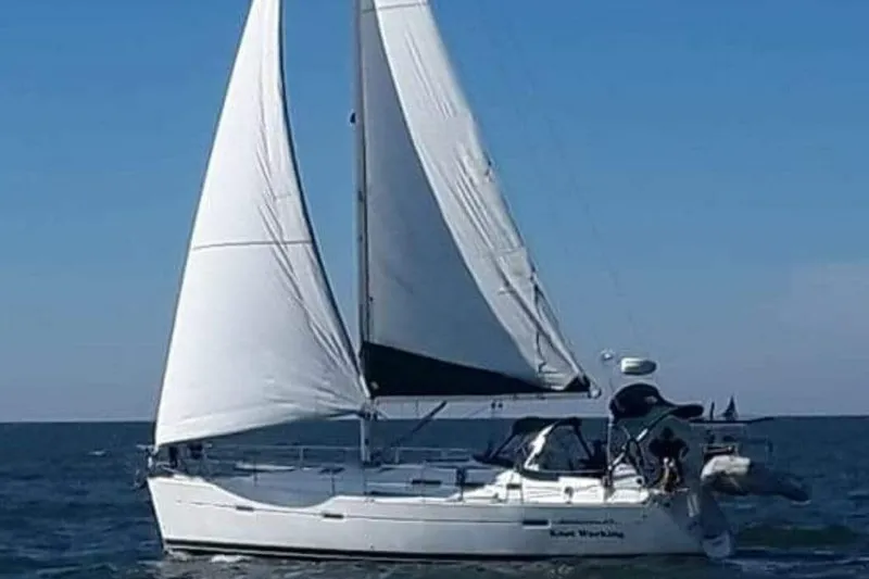 Slide: The Image of 2005 Beneteau Oceanis 373 sailboat cruising on open water under clear skies. - 65