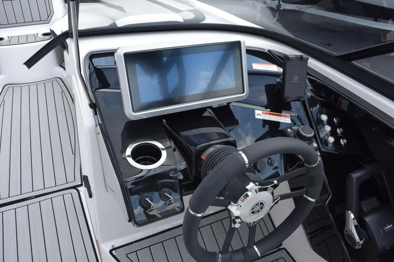 Slide: The Image of 2026 Yamaha Boats 252S dashboard with steering wheel and touchscreen display. - 14
