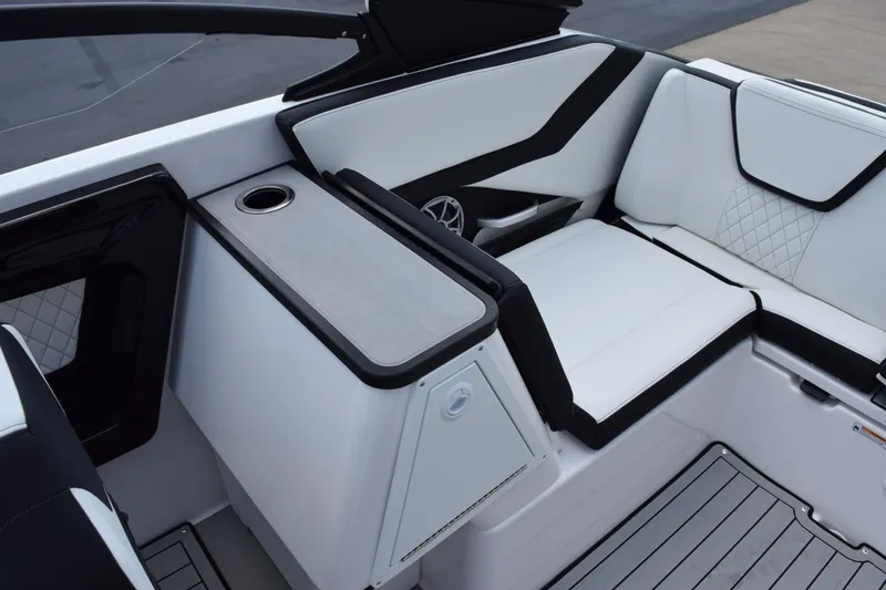 Slide: The Image of 2026 Yamaha Boats 252S interior with white seating and cup holder. - 16