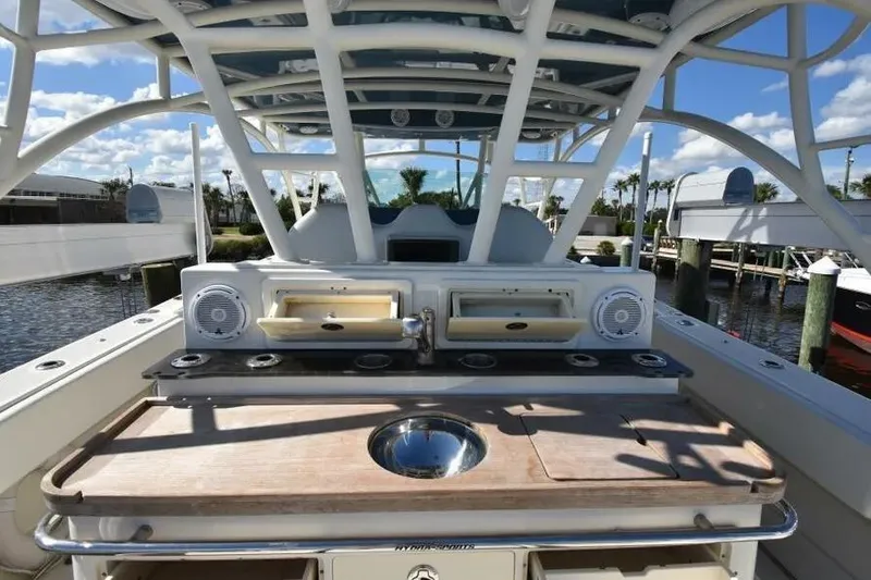 Slide: The Image of 2012 Hydra-Sports 4200 Siesta boat with outdoor kitchen and speakers at marina. - 10