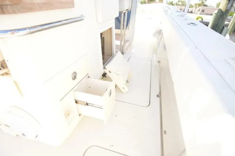 Slide: The Image of 2012 Hydra-Sports 4200 Siesta boat interior with open storage compartments. - 11