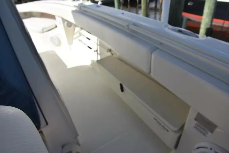 Slide: The Image of 2012 Hydra-Sports 4200 Siesta boat interior with seating and storage compartments. - 13