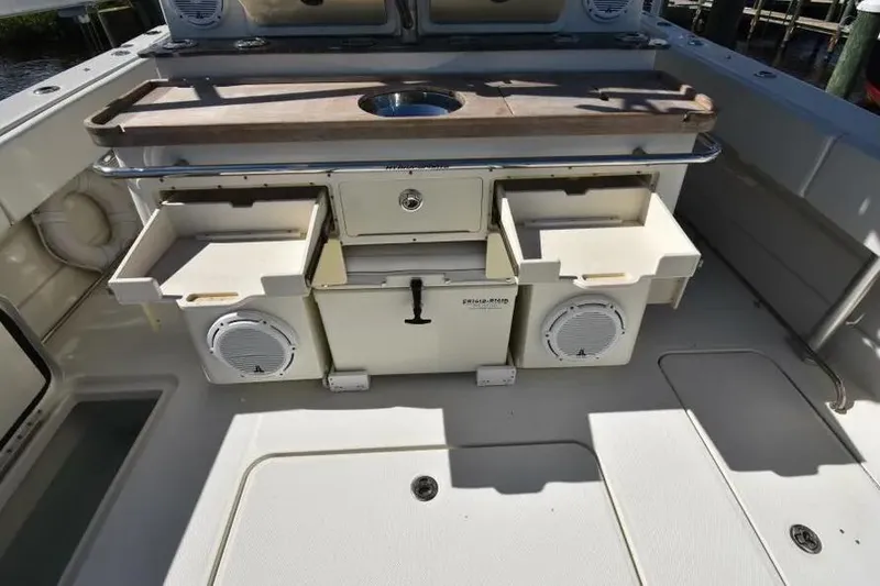 Slide: The Image of 2012 Hydra-Sports 4200 Siesta boat interior with storage compartments and speakers. - 17