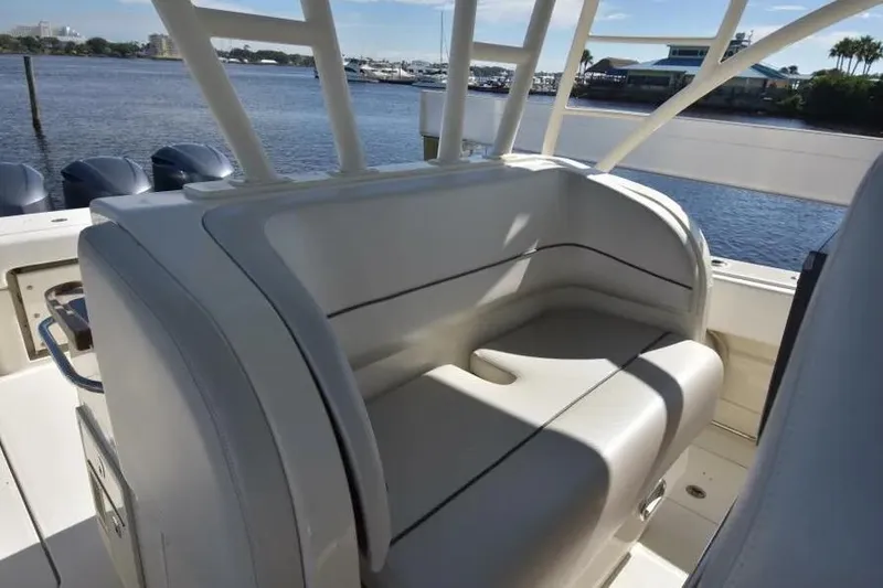 Slide: The Image of 2012 Hydra-Sports 4200 Siesta boat interior with cushioned seating by the water. - 19