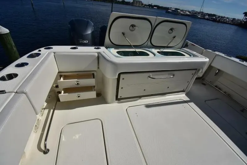 Slide: The Image of 2012 Hydra-Sports 4200 Siesta boat deck with storage and livewell compartments. - 21