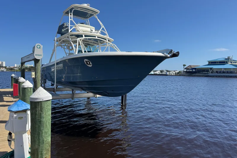 Slide: The Image of 2012 Hydra-Sports 4200 Siesta boat docked at marina under clear blue sky. - 25
