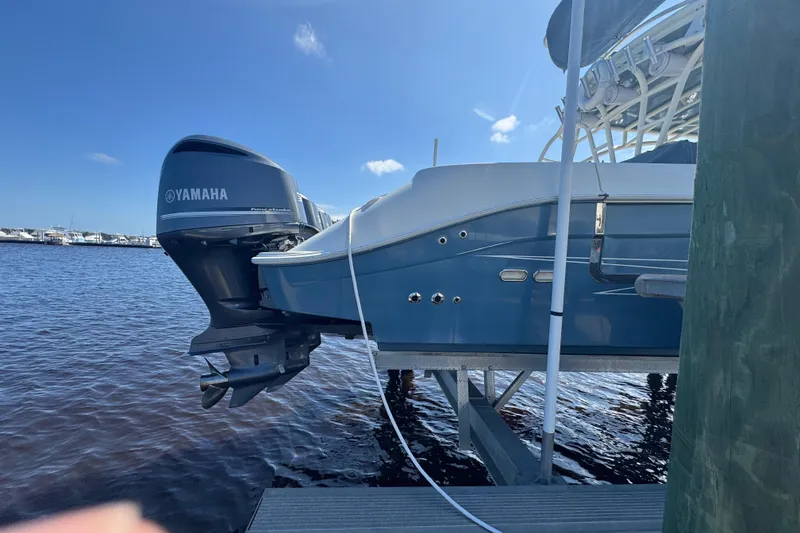 Slide: The Image of 2012 Hydra-Sports 4200 Siesta boat with Yamaha engine docked by the water. - 29